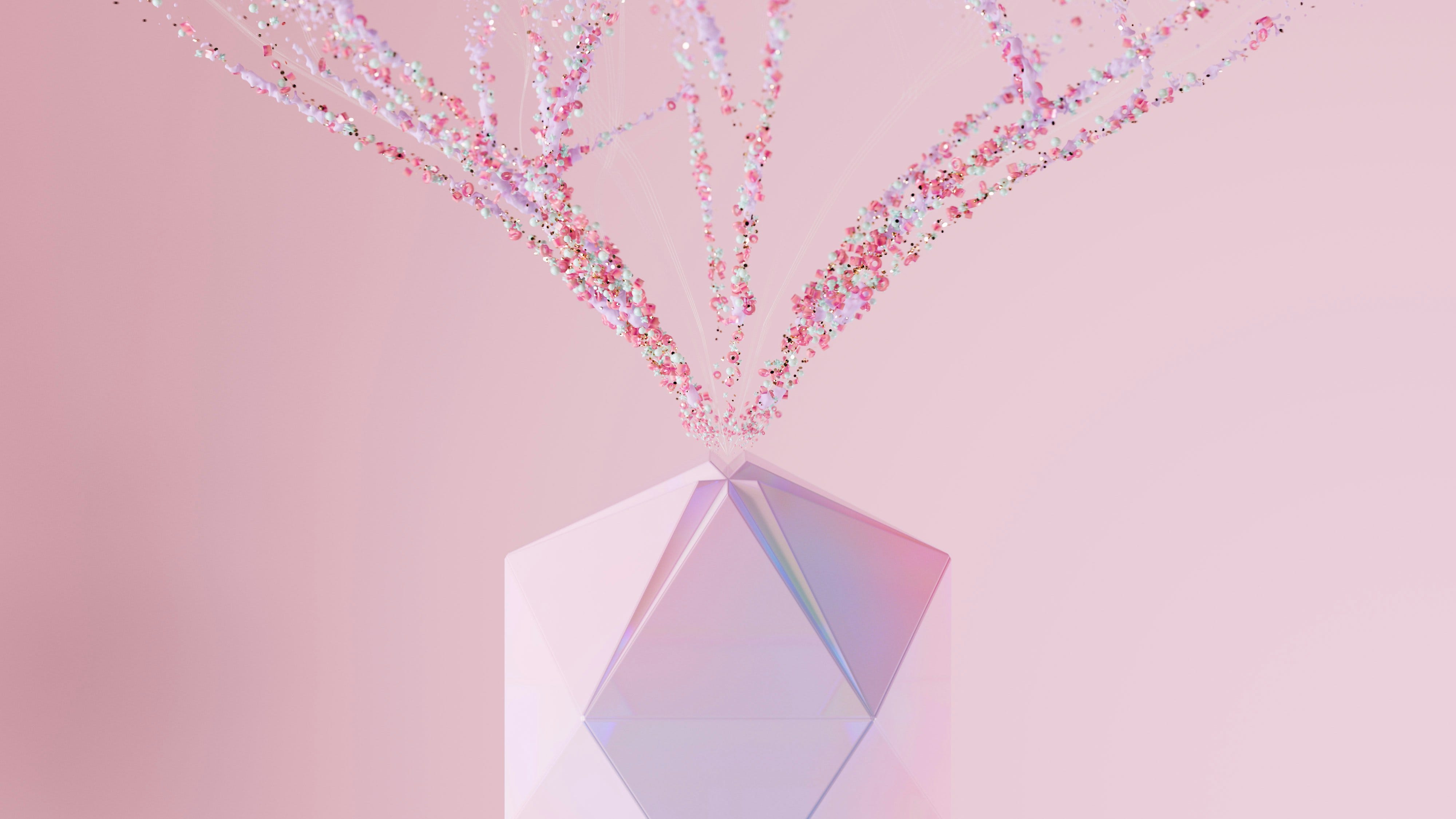 Abstract 3D render of a crystal polyhedron releasing streams of pink and mint particles